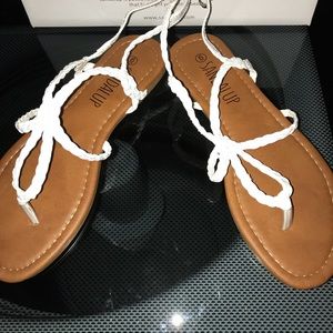 Never worn white sandals.